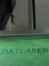 Dat Logo Marked in the Green Towel